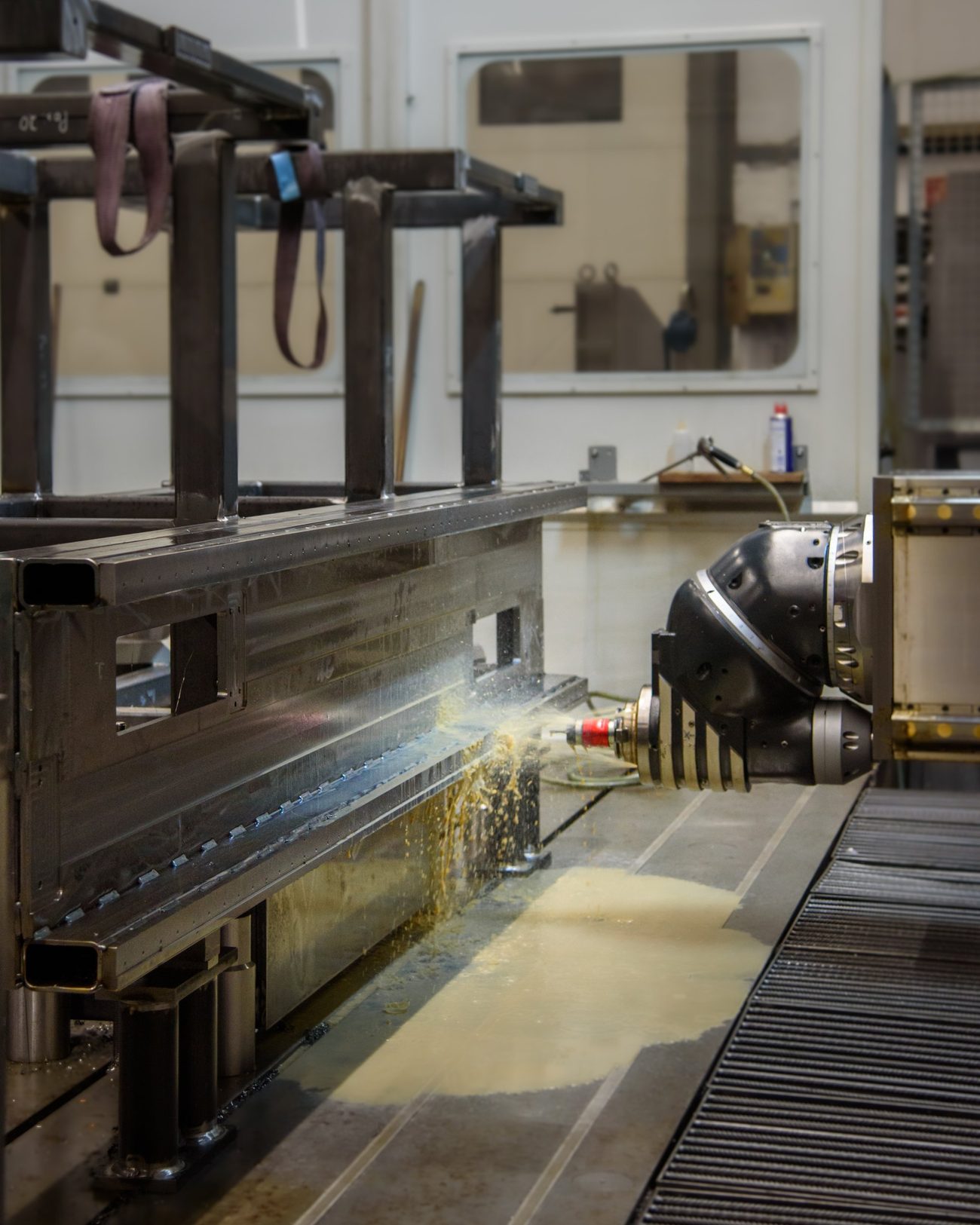 Welded steel frame being machined
