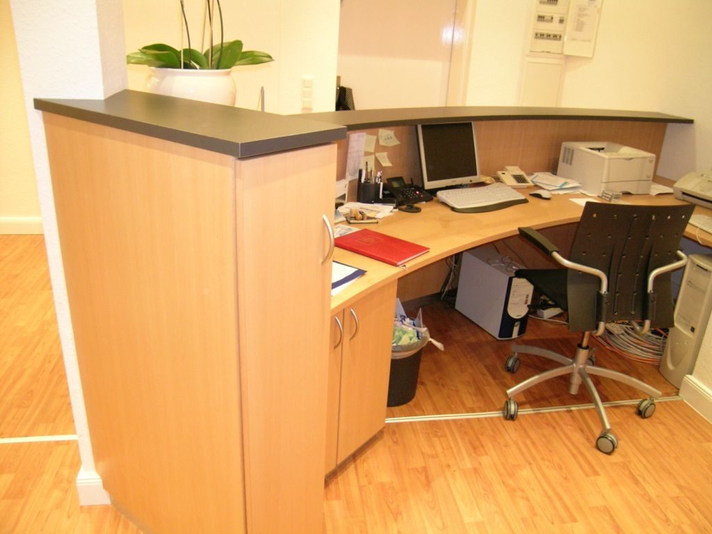 Wooden reception desk with workstation